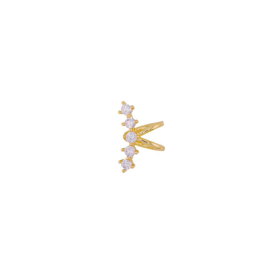 Este earcuff está diseñado para colocarse en la parte posterior de la oreja, creando un efecto visual único, su delicada estructura resalta por una serie de circones brillantes que añaden un toque de luminosidad. Ideal para quienes buscan un accesorio único, este ear cuff aporta un estilo audaz sin necesidad de perforaciones adicionales, convirtiéndose en el complemento perfecto para cualquier ocasión.